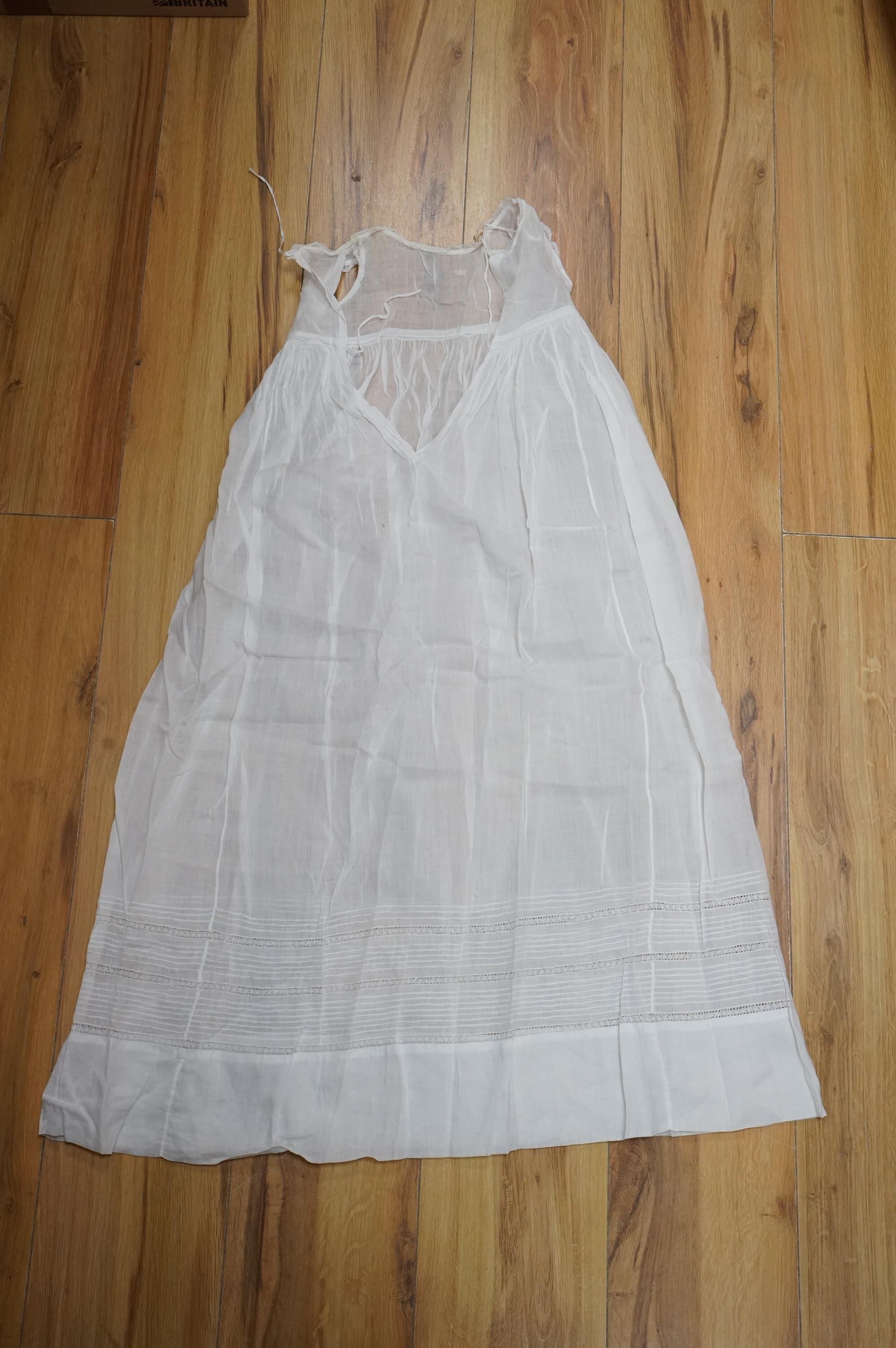 A collection Victorian textiles to include a lace christening gown, Irish crochet and a net baby gown